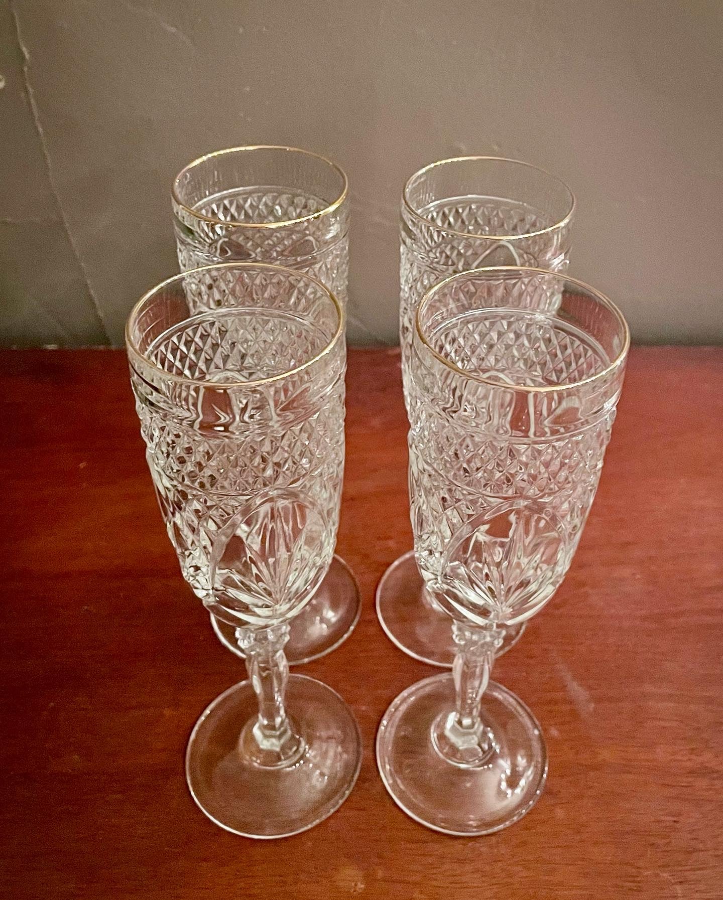 Gold-Rimmed Champagne Glasses